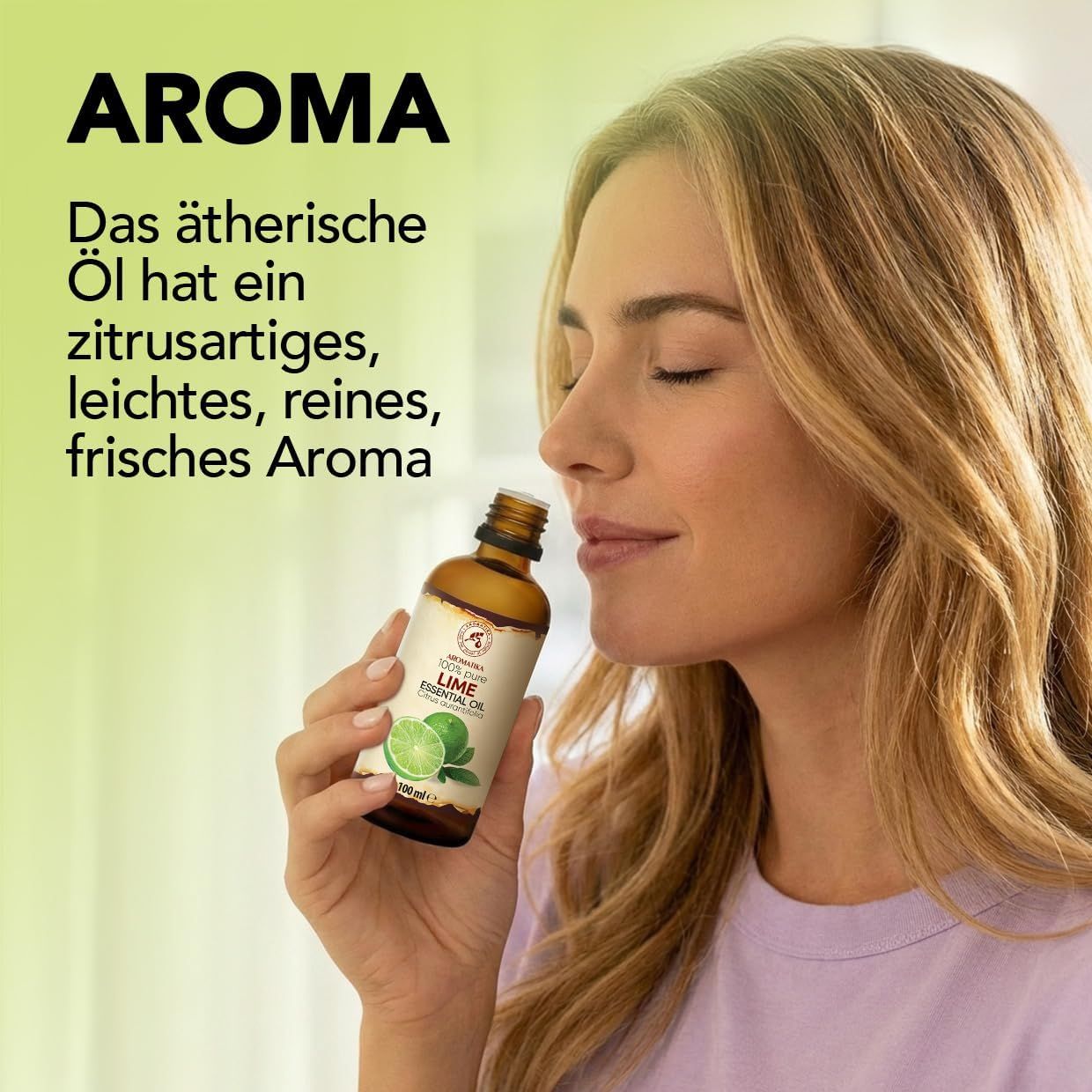 Frau riecht an einer Flasche ätherischem Limettenöl, "AROMA" und "Das ätherische Öl hat ein zitrusartiges, leichtes, reines, frisches Aroma" auf Deutsch.