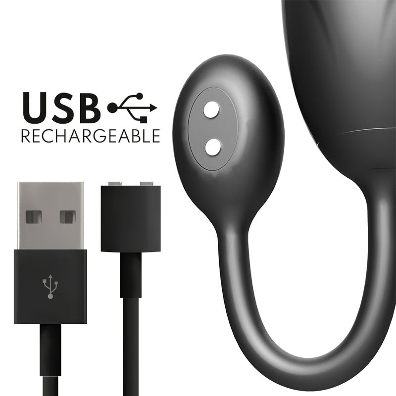Nahaufnahme des grauen Wellness-Produkts mit USB-Anschluss und Ladekabel. Zwei runde Elemente.