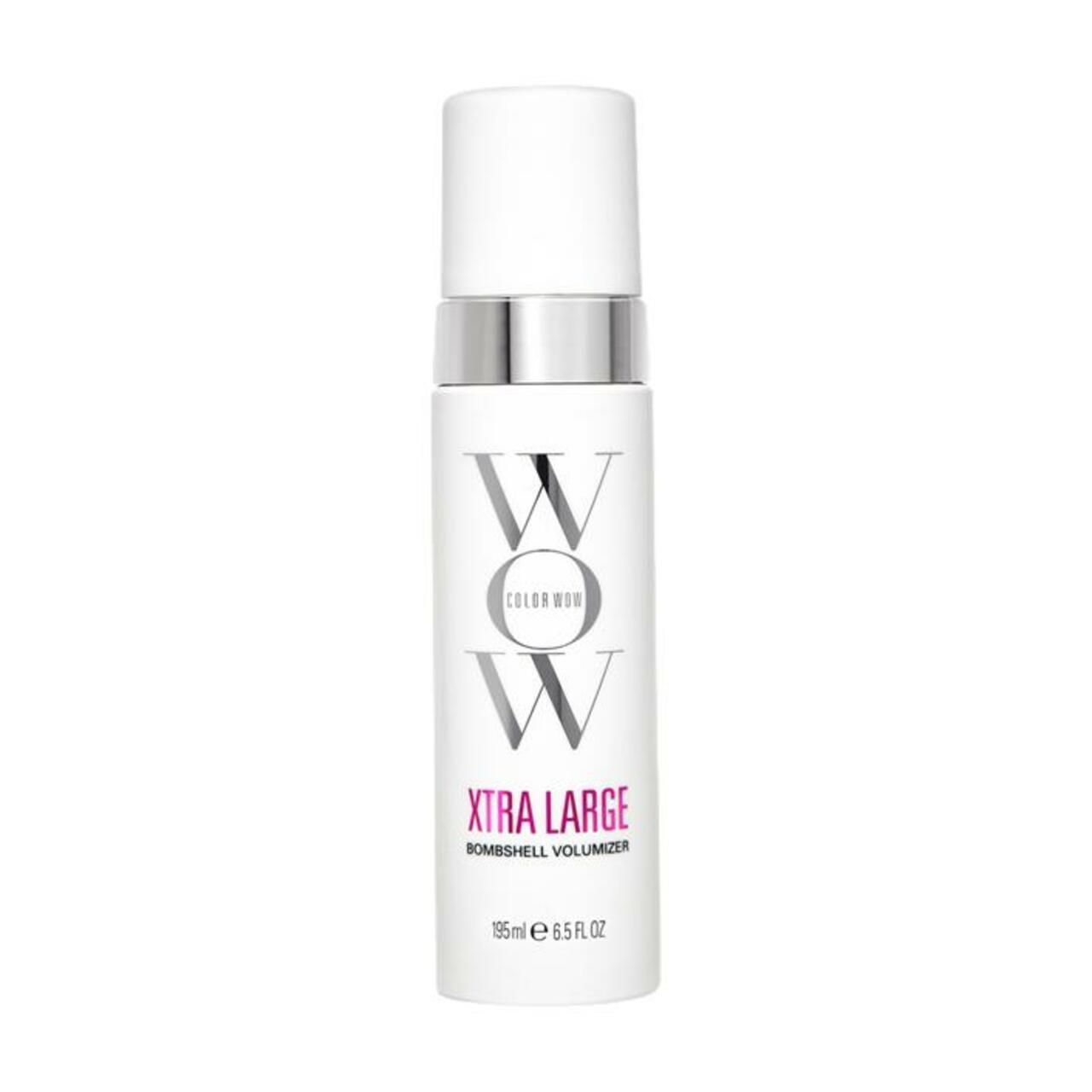 Weißes Produkt mit silbernem Ring und weißem Deckel. Schriftzug 'WOW' und 'XTRA LARGE' sichtbar. 'Bombshell Volumizer' darunter.