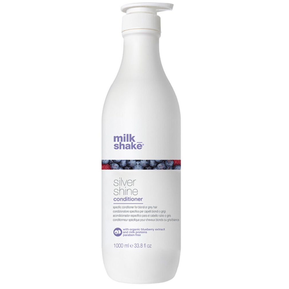 Weiße Flasche mit Pumpe. Aufschrift: milk_shake Silver shine conditioner. Enthält Blaubeerextrakt. 1000 ml.