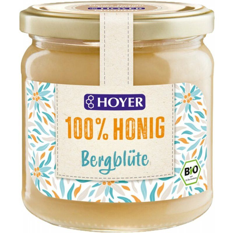 Glas Honig mit Etikett. Aufschrift: HOYER, 100% Honig, Bergblüte. Bio-Siegel. Deckel goldfarben.