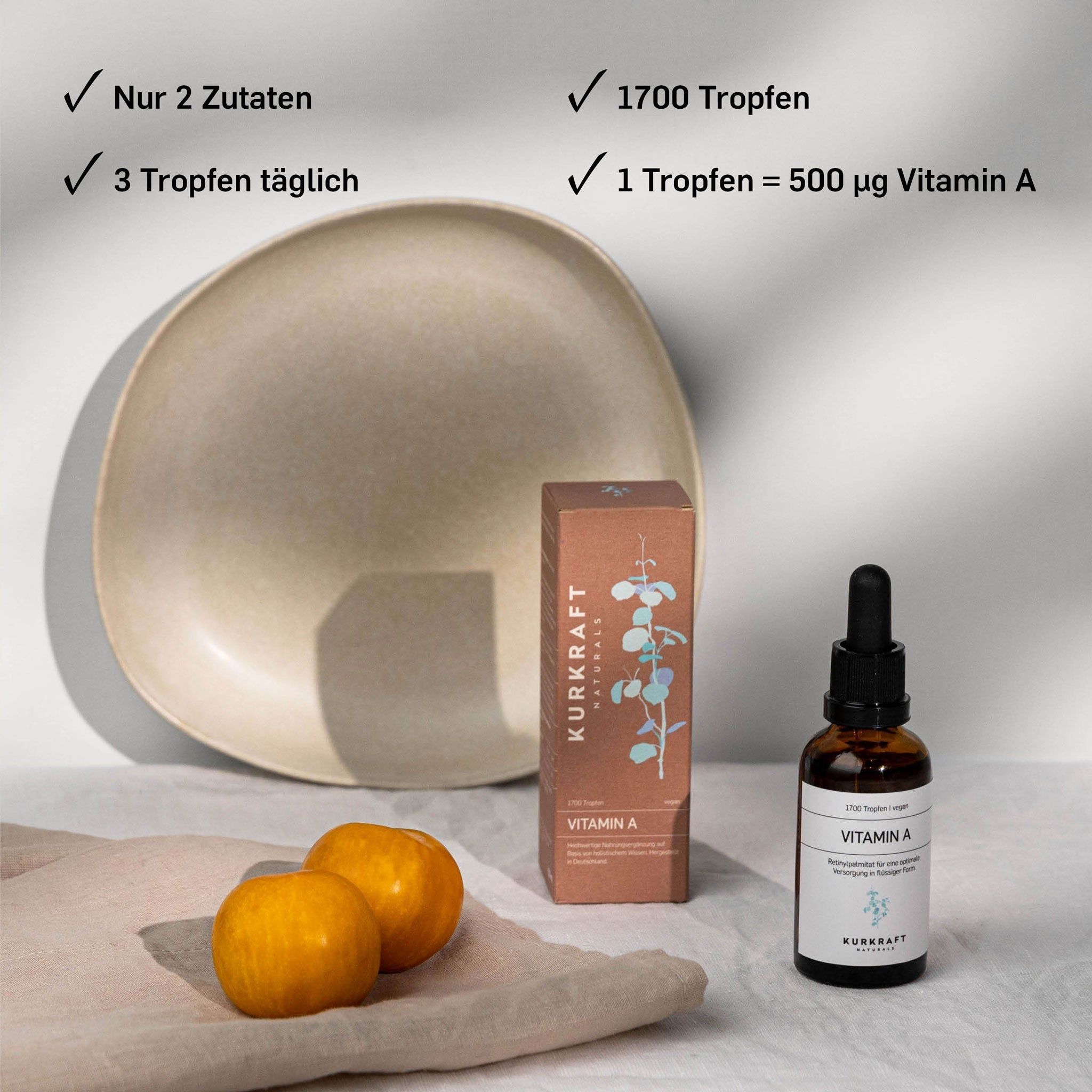 Produkt mit Flasche, Verpackung, zwei Orangen und Schale. Aufschrift: Kurkraft, Vitamin A. Angaben: 2 Zutaten, 1700 Tropfen, 3 Tropfen täglich.