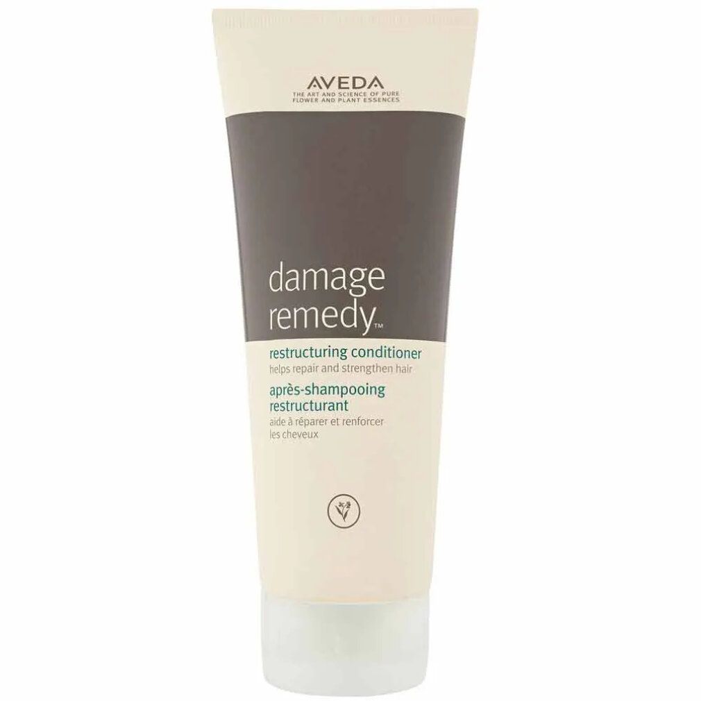 Creme-Tube mit Produktnamen und Markennamen. Text: Damage Remedy, Restructuring Conditioner. 200 ml.
