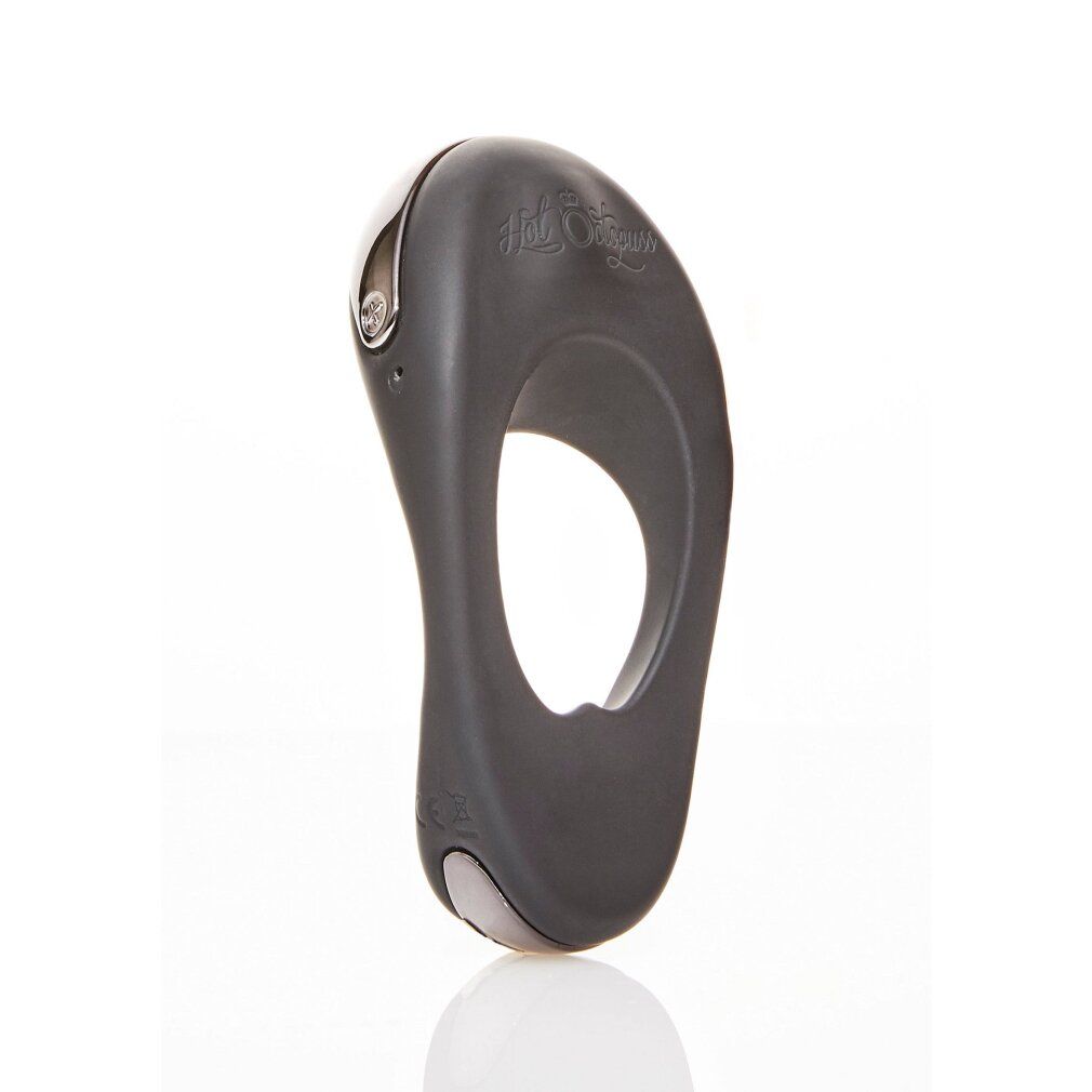 Dunkelgrauer Cockring mit ovaler Öffnung. Oberseite mit silberfarbenem Akzent und Logo. Unterseite mit silberfarbenem Element.