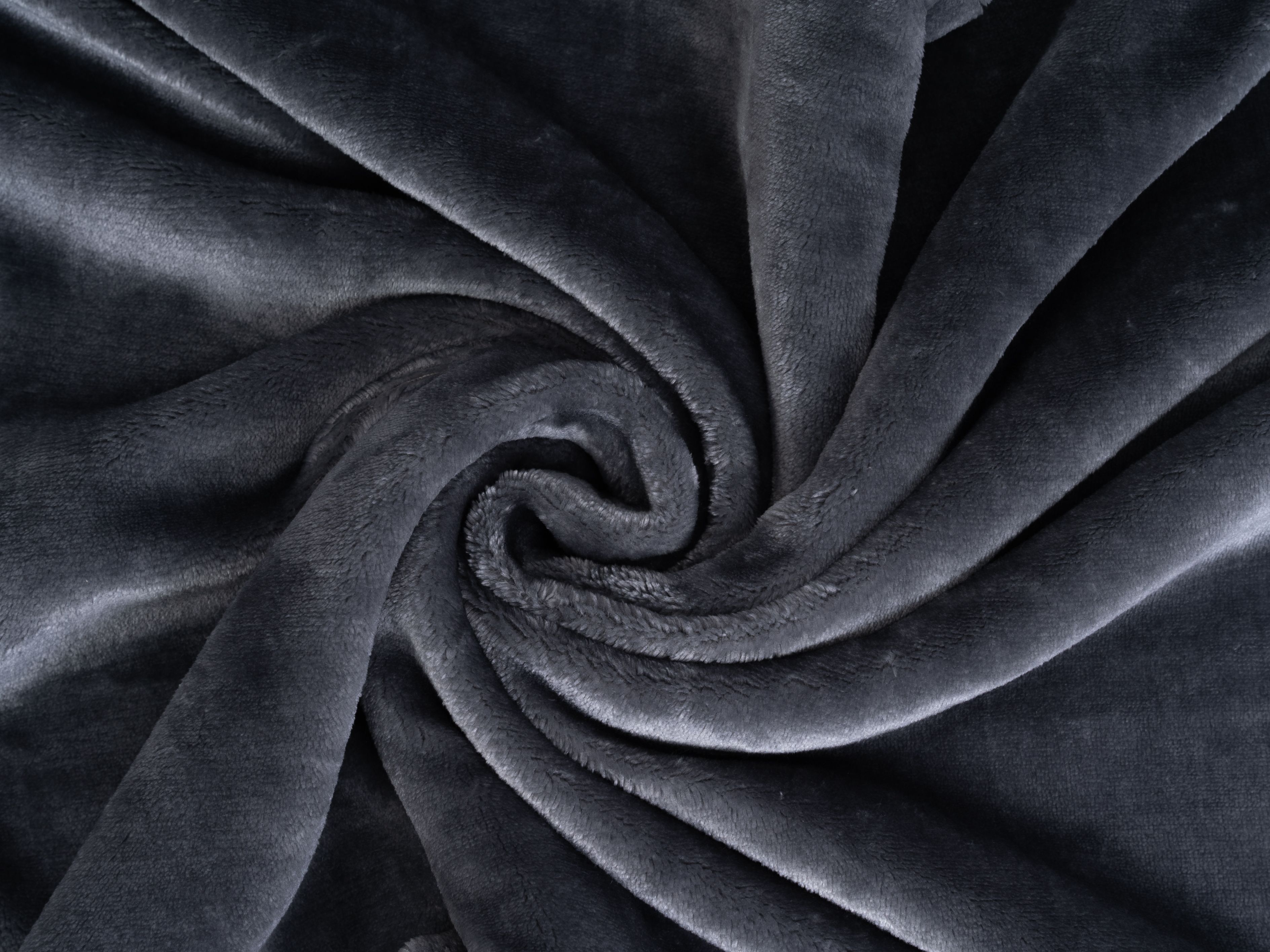 Graue Kuscheldecke, Nahaufnahme, gewirbeltes Muster. Weiches Material, Textur sichtbar.