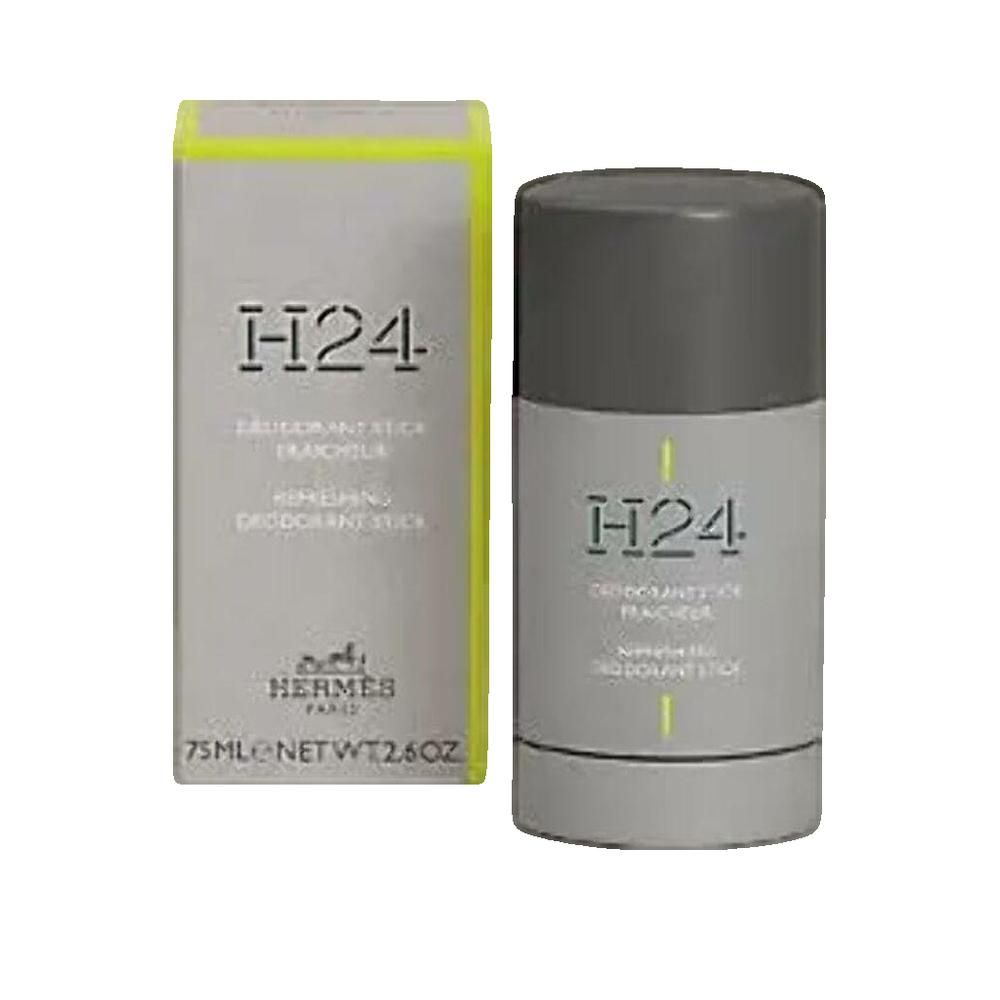Deodorant-Stick und Verpackung. Grauer Stick mit Deckel, graue Verpackung mit gelben Akzenten. Schriftzug: H24, Hermes Paris.