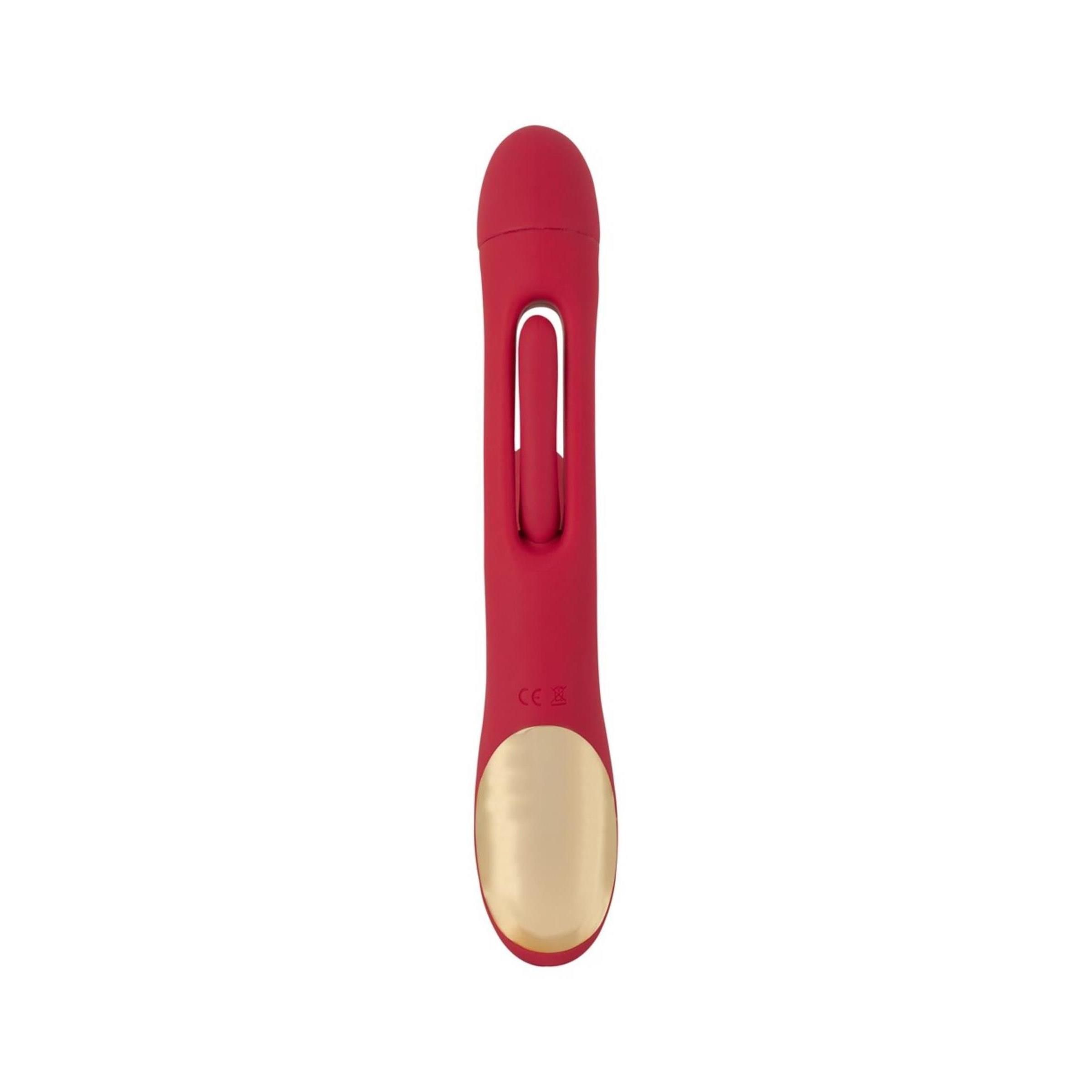 Roter Vibrator mit länglicher Form. Der Kopf ist länglich, der Schaft hat eine Öffnung. Mit goldfarbenem Teil.
