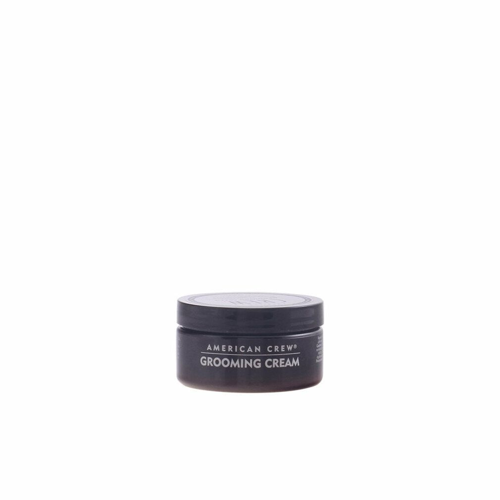 Runde, schwarze Dose mit Deckel. Aufschrift: AMERICAN CREW GROOMING CREAM.