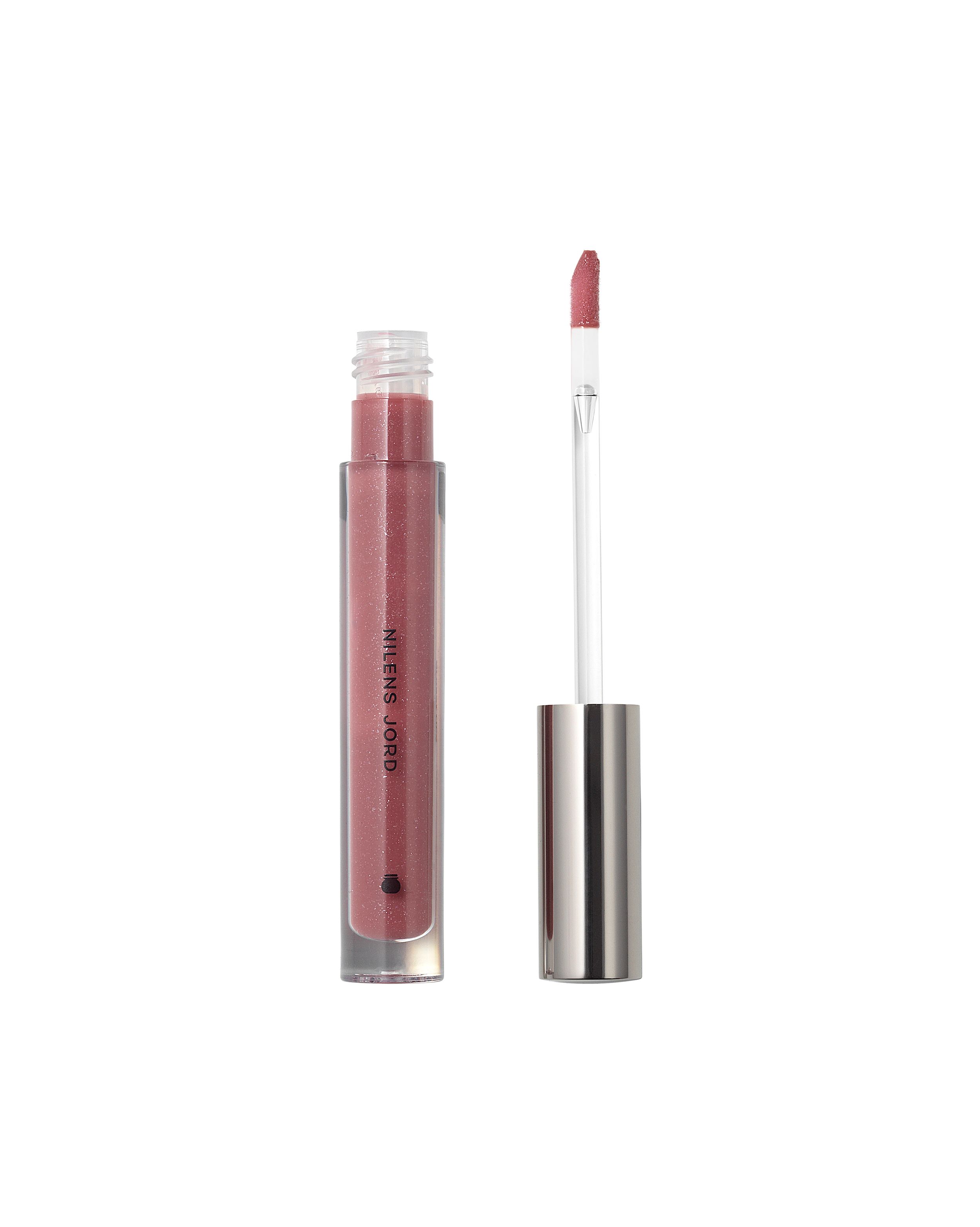 Nilens Jord Glossy Lips Lippenstift in transparenter Hülse mit silbernem Deckel und Applikator.