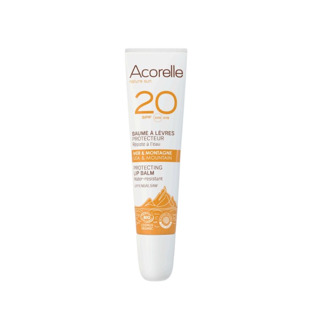Weiß-orange Tube mit Aufschrift Acorelle, 20 SPF, Lippenbalsam. Text: Meer & Berg, schützend, wasserfest.
