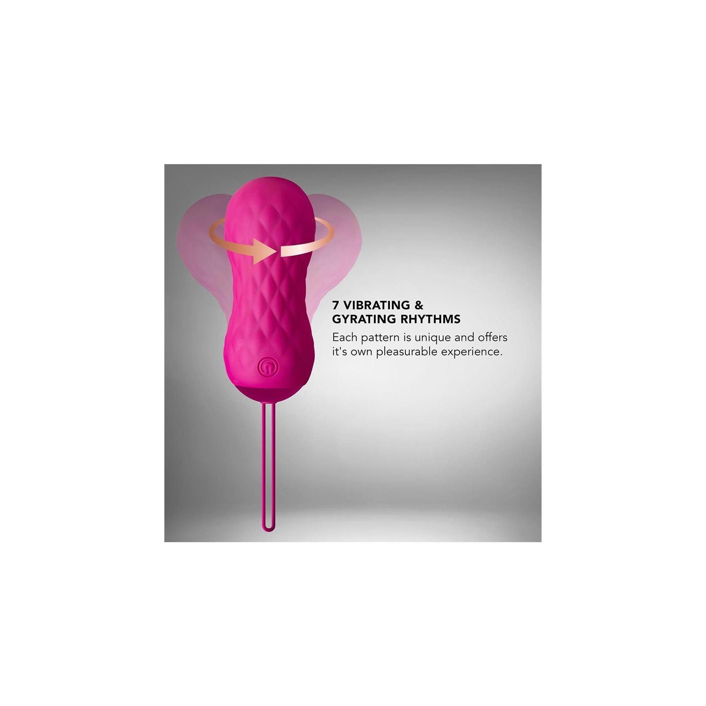 Rosa Vibrator mit Zugschlaufe. Text: „7 VIBRATIONS- & GYRATIONS-RHYTHMEN“. Pfeile zeigen die Drehbewegung an. Der Vibrator hat ein Muster.