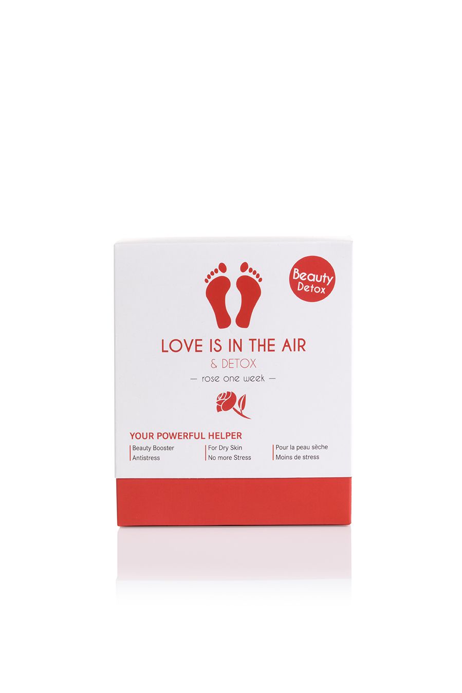 Weiße Schachtel mit rotem Boden. Aufdruck: "LOVE IS IN THE AIR & DETOX". Logo: Füße. Text: Beauty Detox. Für trockene Haut, weniger Stress.