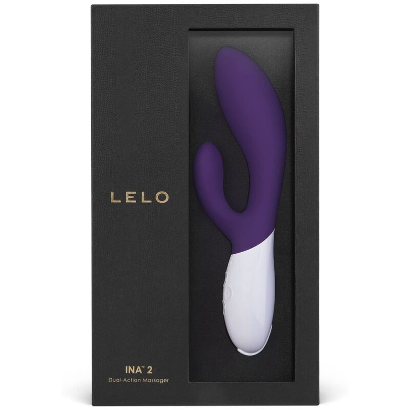 Schwarze Verpackung mit Sichtfenster. Lila-weißer Vibrator im Inneren. Marke LELO und Produktname INA 2.