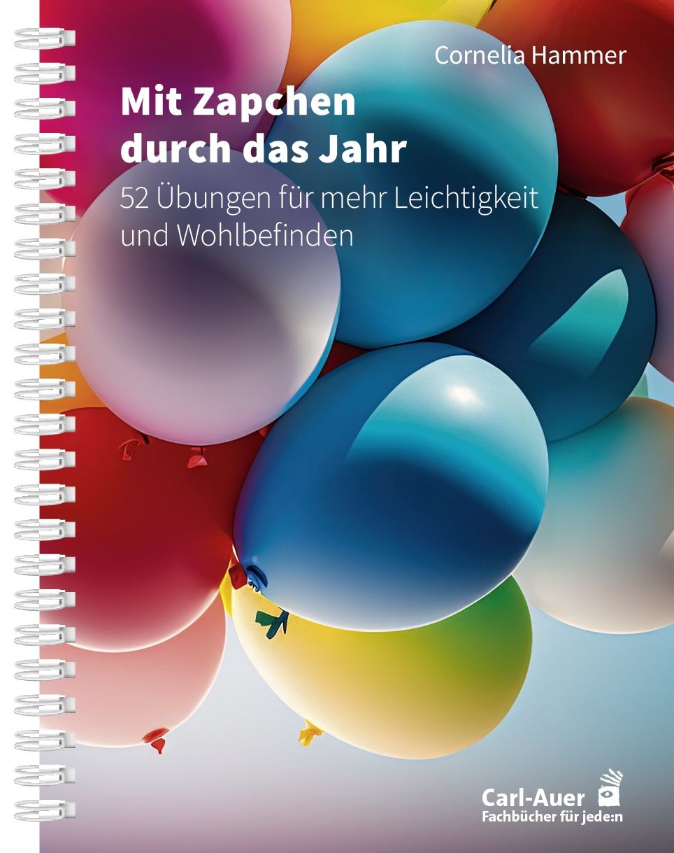 Spiralgebundenes Buch mit Titel „Mit Zapchen durch das Jahr“. Auf dem Cover sind bunte Ballons abgebildet. Autorin: Cornelia Hammer.