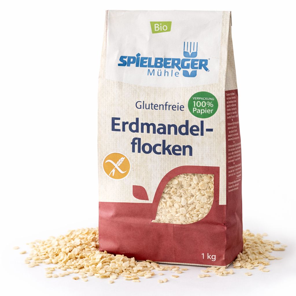 Bio Erdmandel-Flocken von Spielberger Mühle, glutenfrei, in 1kg Papierverpackung. Flocken liegen um die Packung.