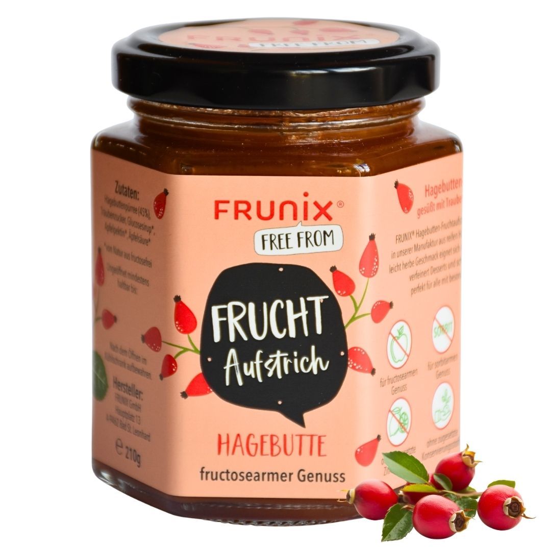 Glas FRUNIX® Hagebutten-Fruchtaufstrich. Rosa Etikett mit Produktname, Logo und Illustrationen. Schwarzer Deckel. Hagebutten-Zweig am unteren Rand.
