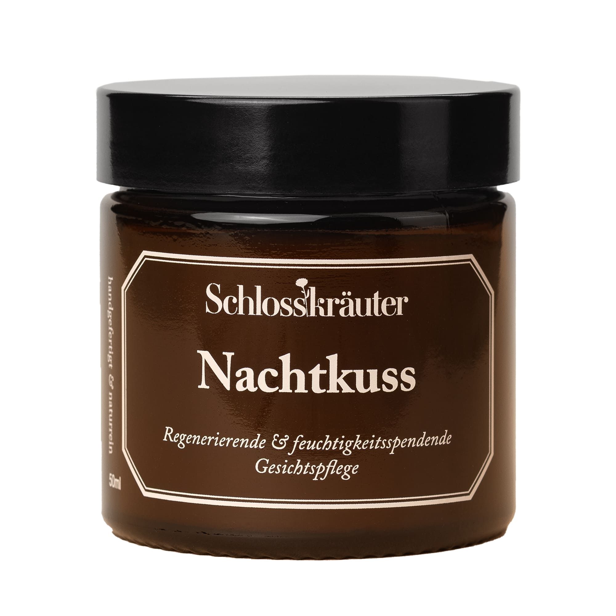 Braunes Glas mit schwarzem Deckel. Aufschrift: Schlosskräuter Nachtkuss, regenerierende Gesichtspflege.