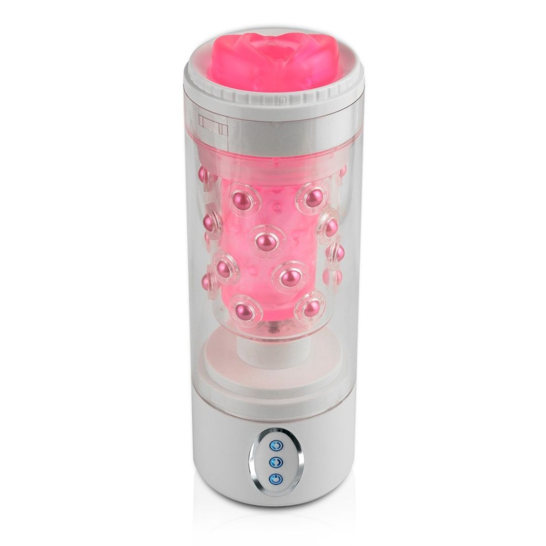 Zylindrisches Gerät mit rosa Innenleben und weißen Elementen. Sichtbare Noppen und Knöpfe.