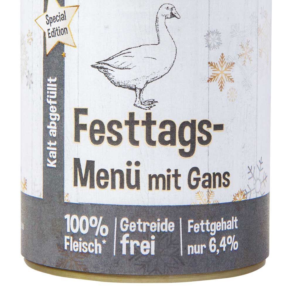 Nahaufnahme einer Dose Schecker Festtags-Menü mit Gans. Enten-Illustration, Text, und Angaben.