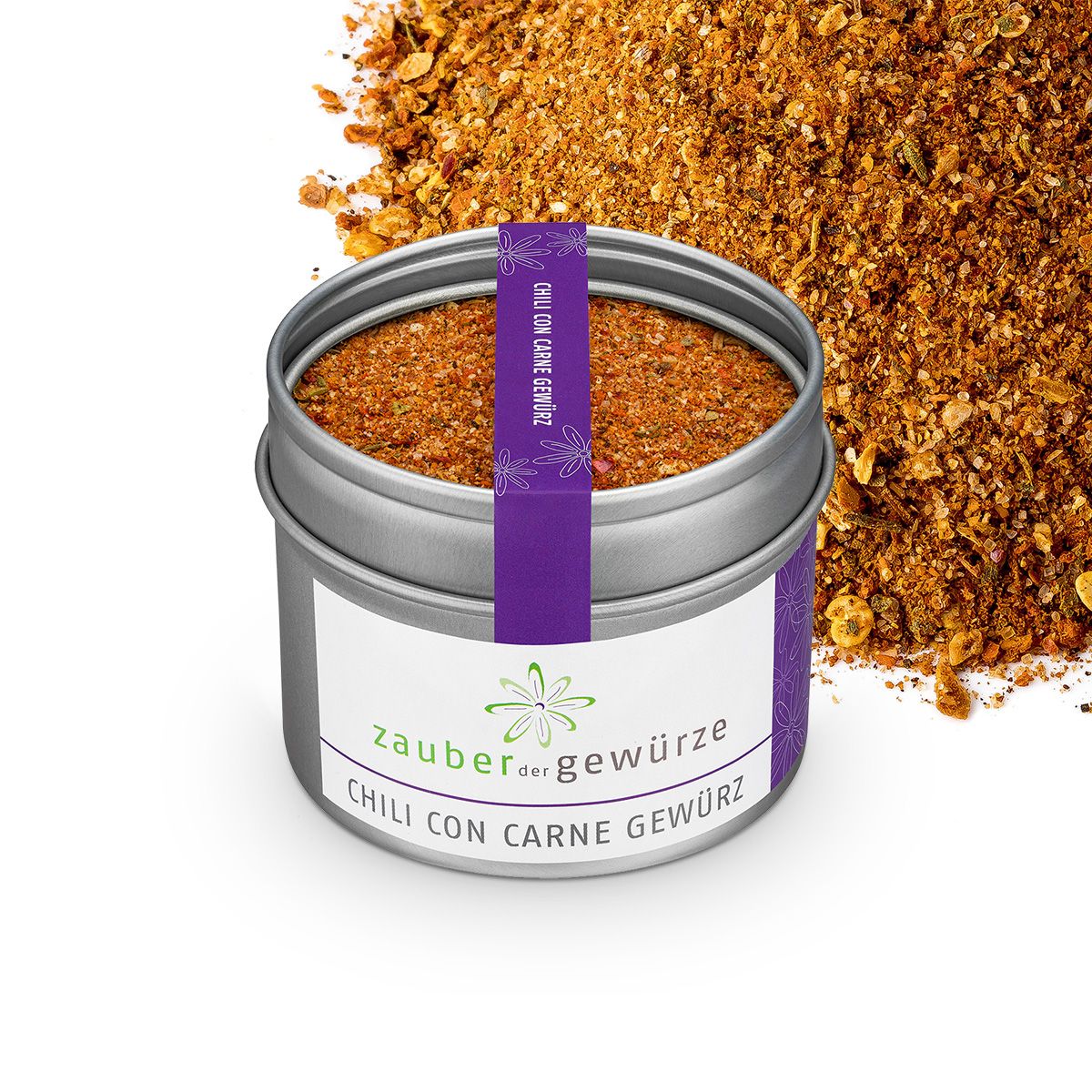 Runde Dose mit Zauber der Gewürze Chili con Carne Gewürz. Gewürzmischung daneben. Weißes Etikett, lila Band mit Text.
