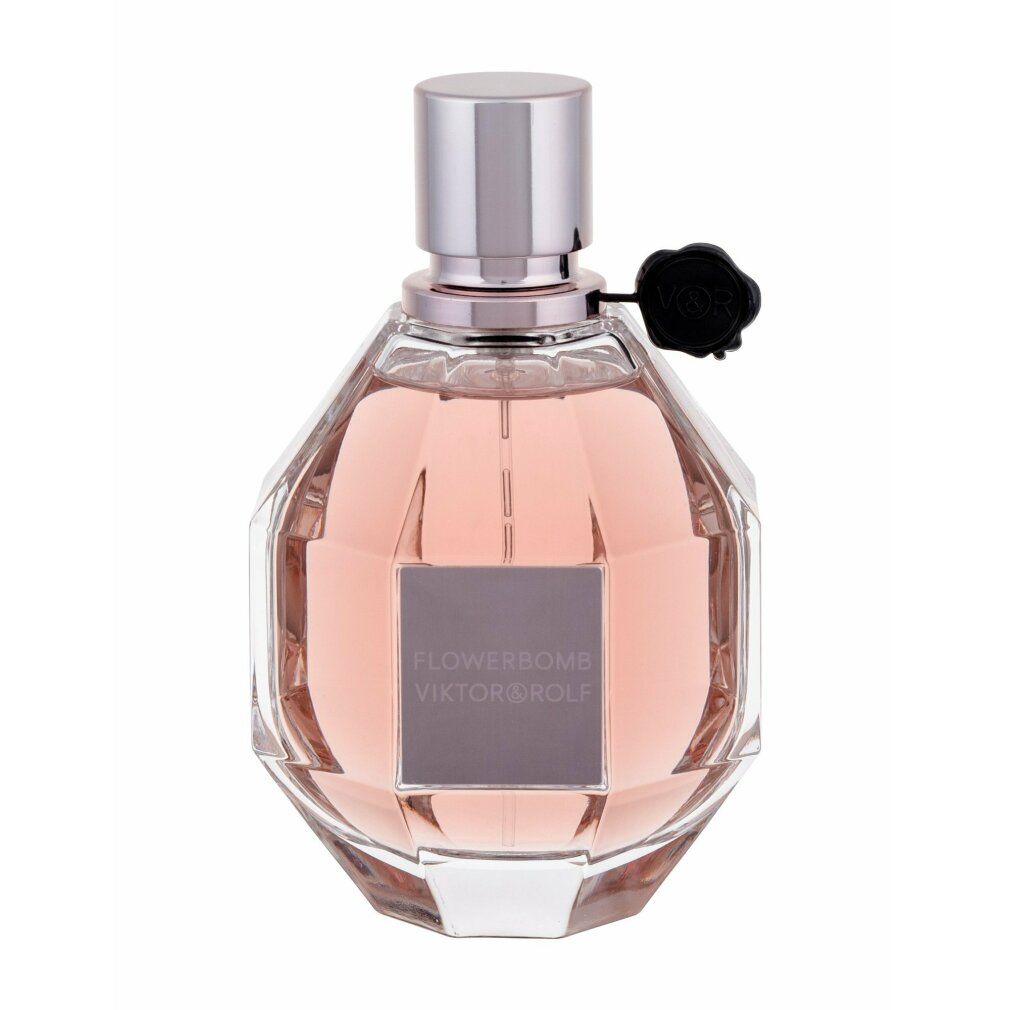Parfümflakon mit rosafarbenem Inhalt. Aufschrift: Flowerbomb Viktor & Rolf. Silberner Verschluss.