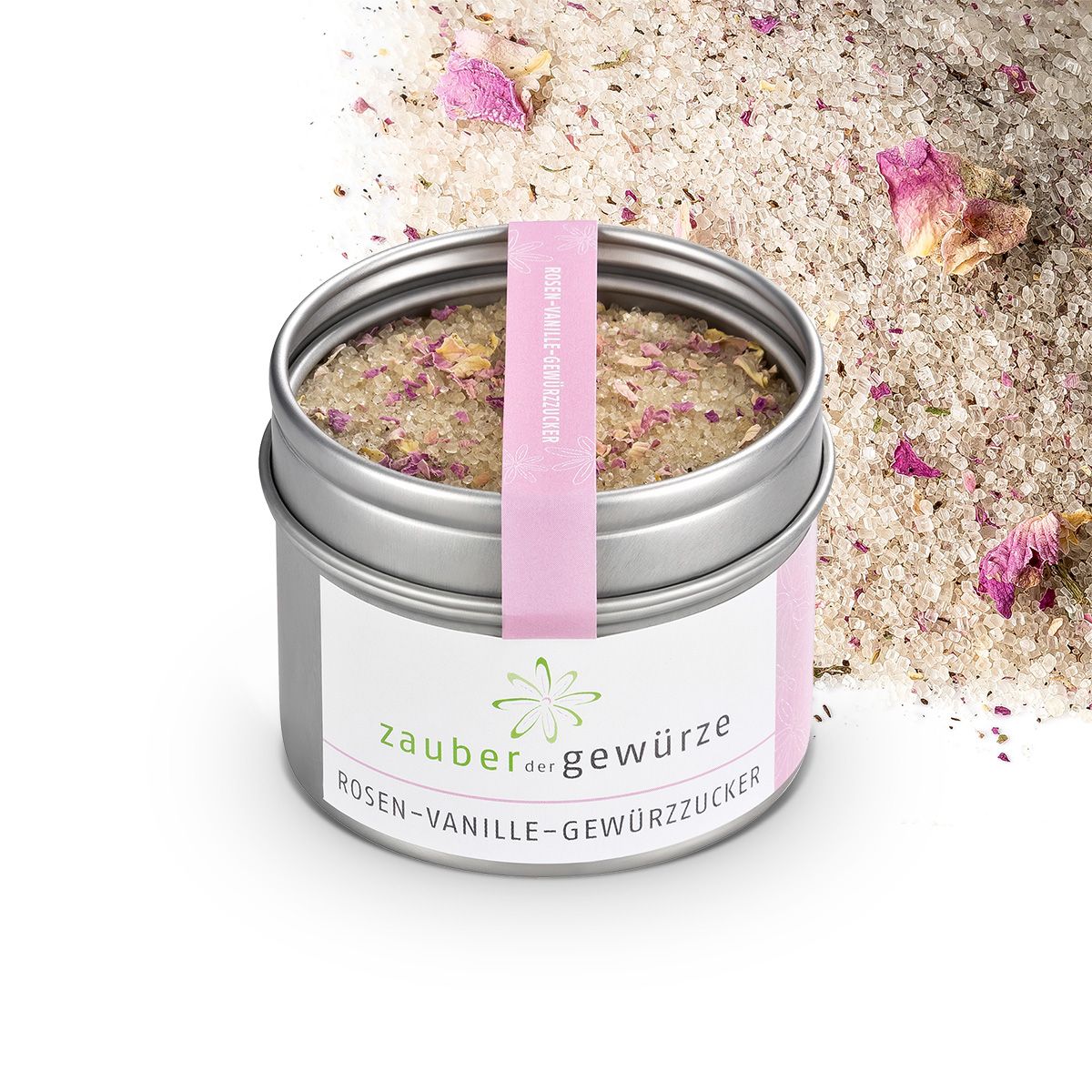 Geöffnete Dose mit Gewürzzucker. Rosa Band mit Text. Produktname und Logo auf dem Etikett. Rosenblüten sichtbar.