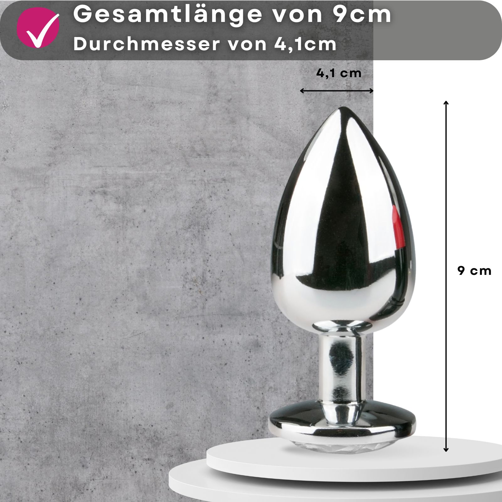 Produktabbildung mit Text: 'Gesamtlänge von 9cm Durchmesser von 4,1cm'. Glänzender Analplug.