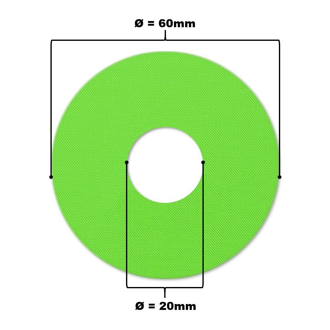 Grüner, kreisförmiger Katheterpatch mit zentralem Loch. Durchmesser 60mm, Loch 20mm.
