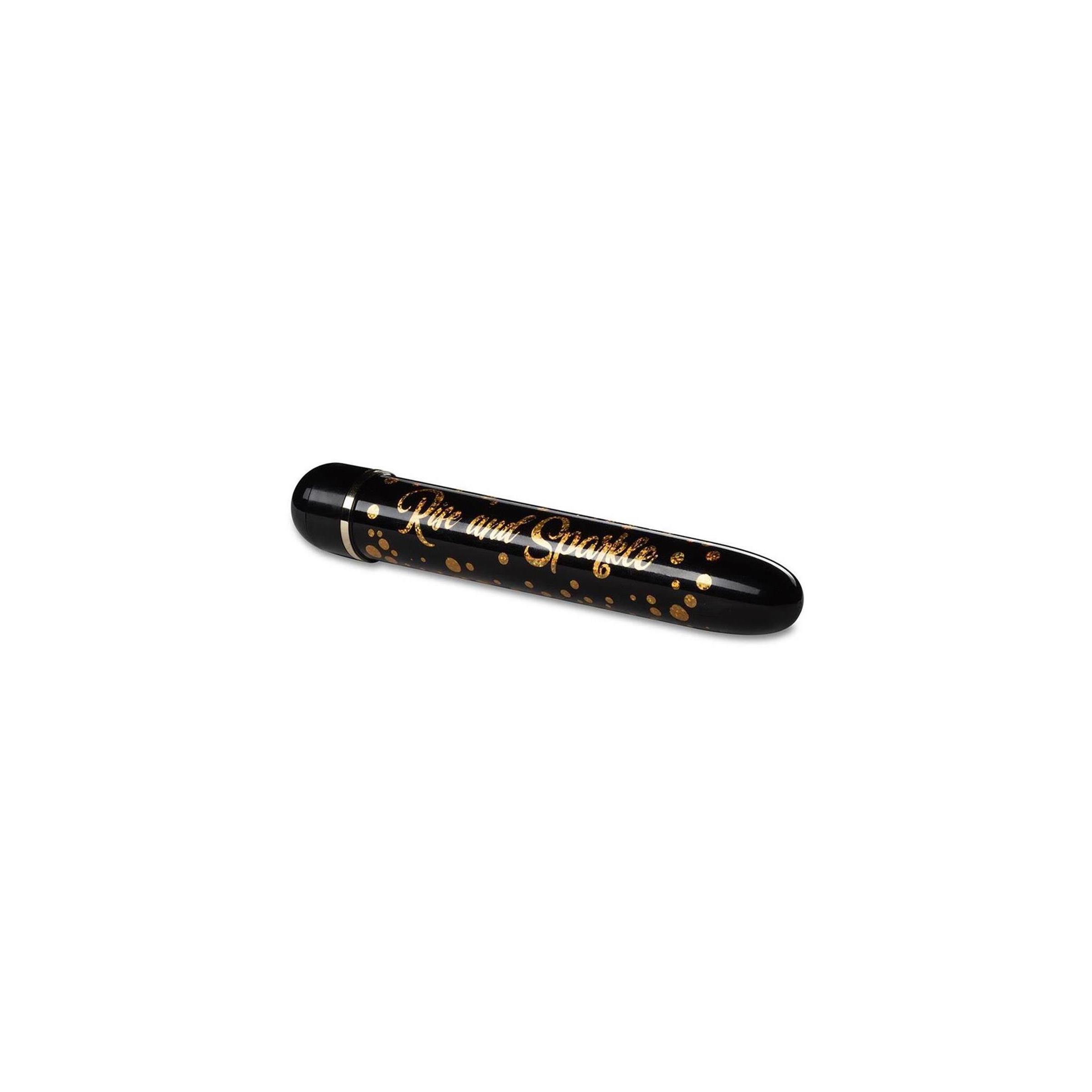 Schwarzer Vibrator mit goldenen Punkten. Aufschrift 'Rise and Sparkle'. Zylindrische Form.