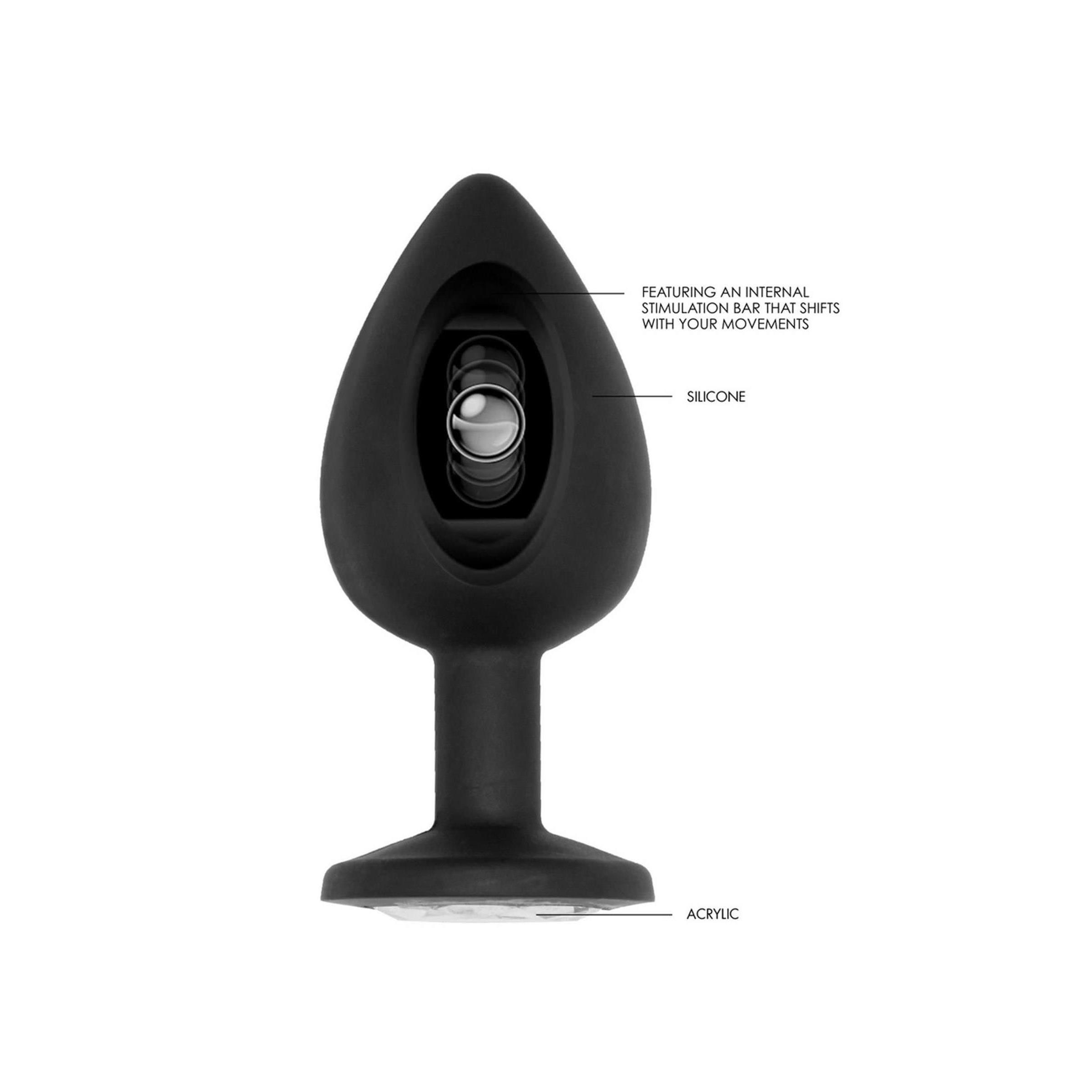 Schwarzer Butt Plug mit sichtbarem Innenleben. Beschriftung: 'Silicone', 'Acrylic'. Interner Stimulationsstab.