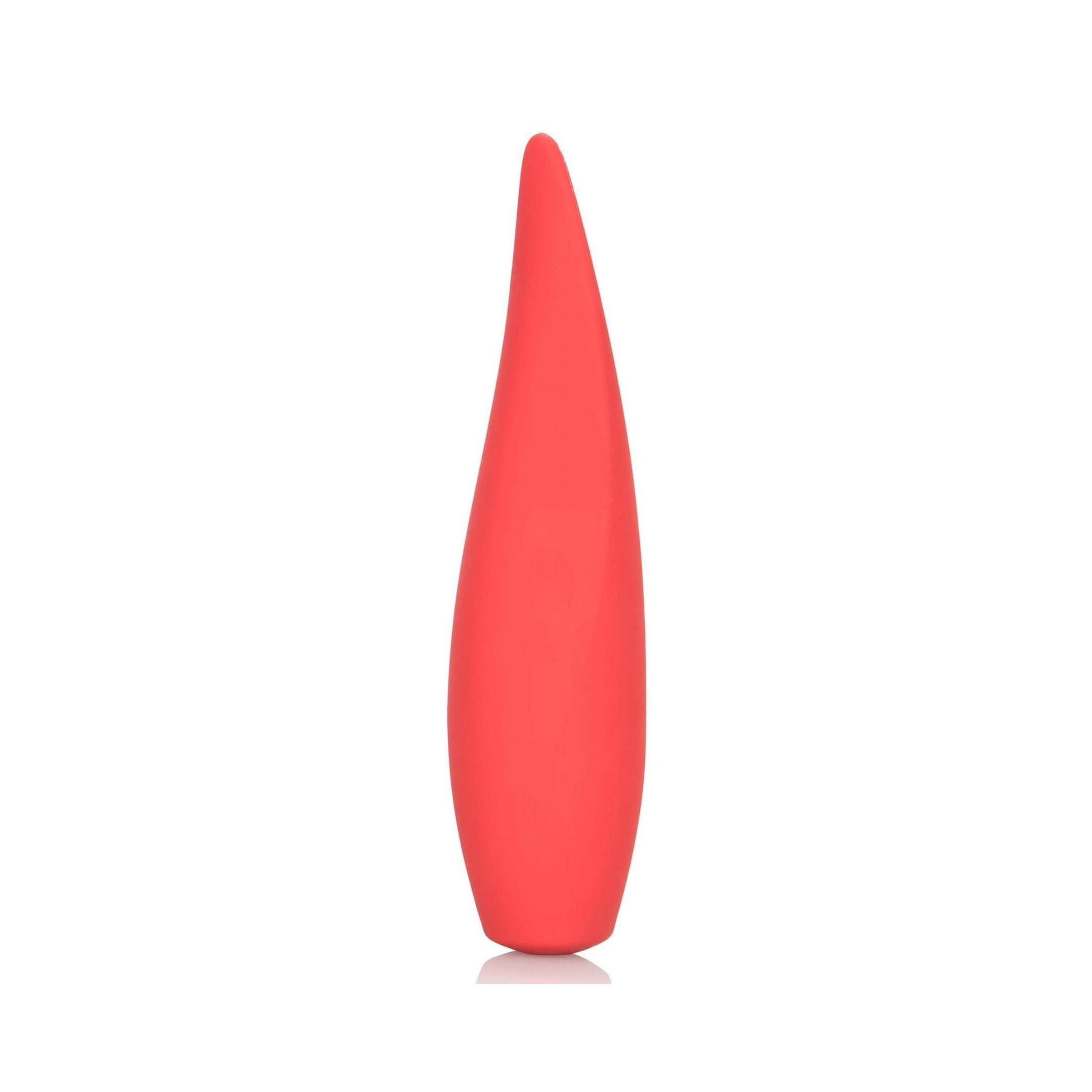 Rotes, längliches Wellness-Produkt. Tropfenförmig, glatte Oberfläche. Steht auf einer reflektierenden Oberfläche.