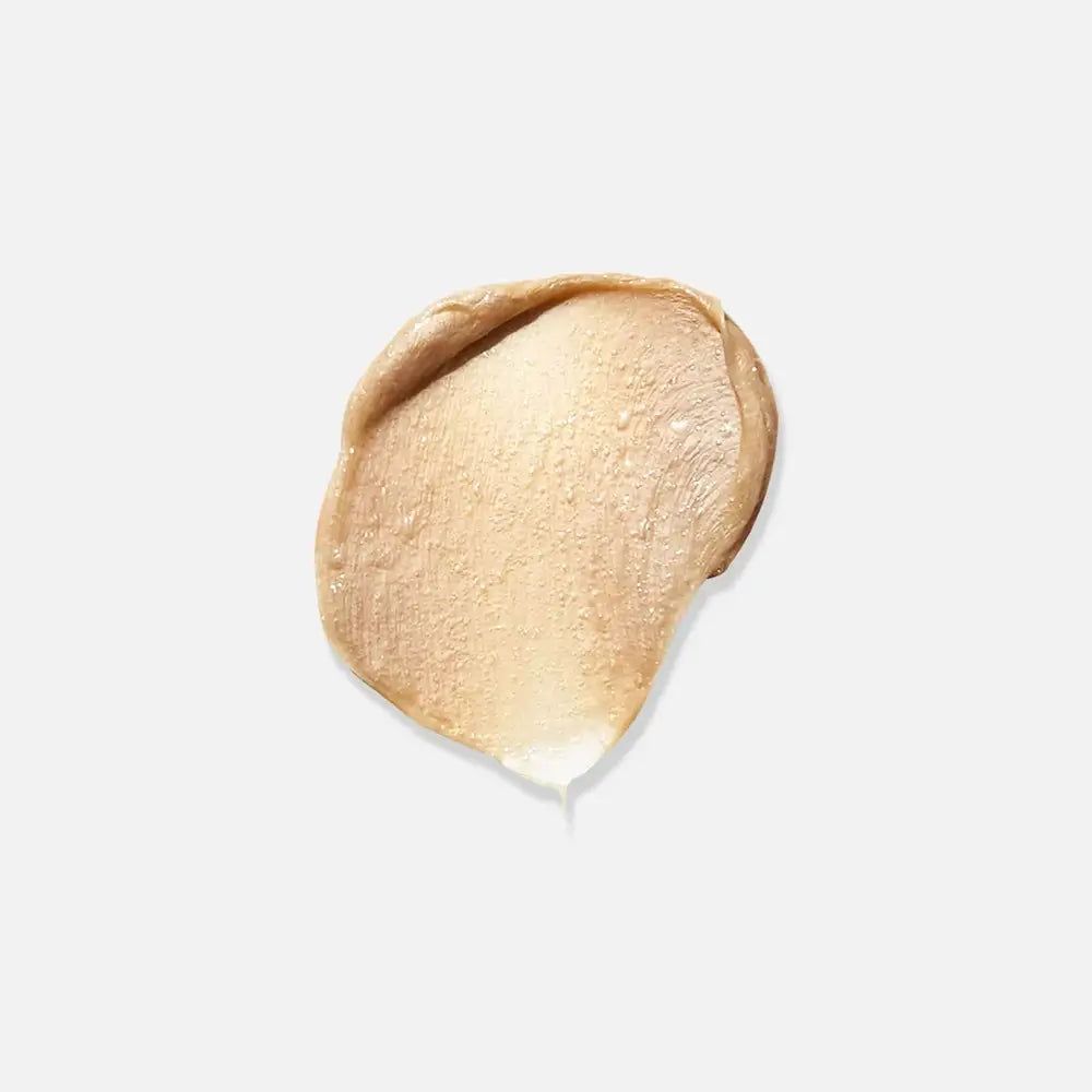 Heller, cremefarbener Klecks. Die Textur ist glatt. Auf weißem Hintergrund.