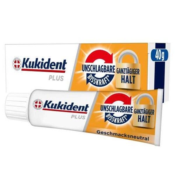 Kukident Plus Haftcreme Tube und Verpackung mit Aufdruck 'Unschlagbare Bisskraft ganztägiger Halt' und '40g'.