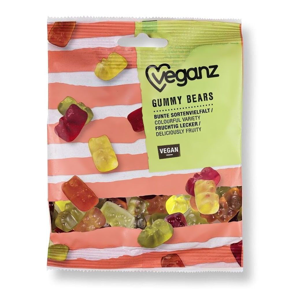 Beutel mit Gummibärchen. Bunte Vielfalt, vegan. Aufschrift: Veganz Gummy Bears. Transparente Verpackung mit rosa Streifen.