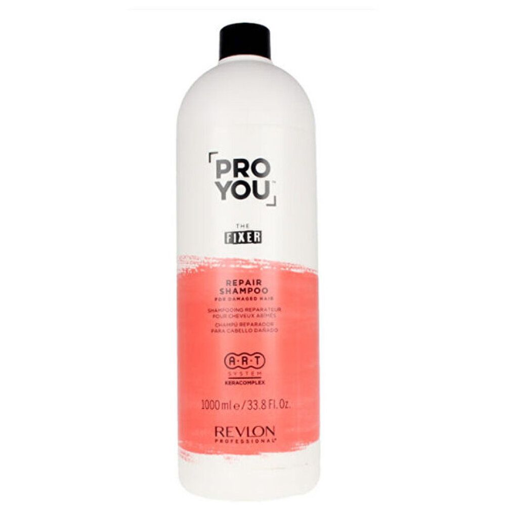 Weiße Flasche mit schwarzem Deckel. Aufschrift: PRO YOU THE FIXER REPAIR SHAMPOO. 1000ml/33.8 Fl. Oz. Revlon Professional.