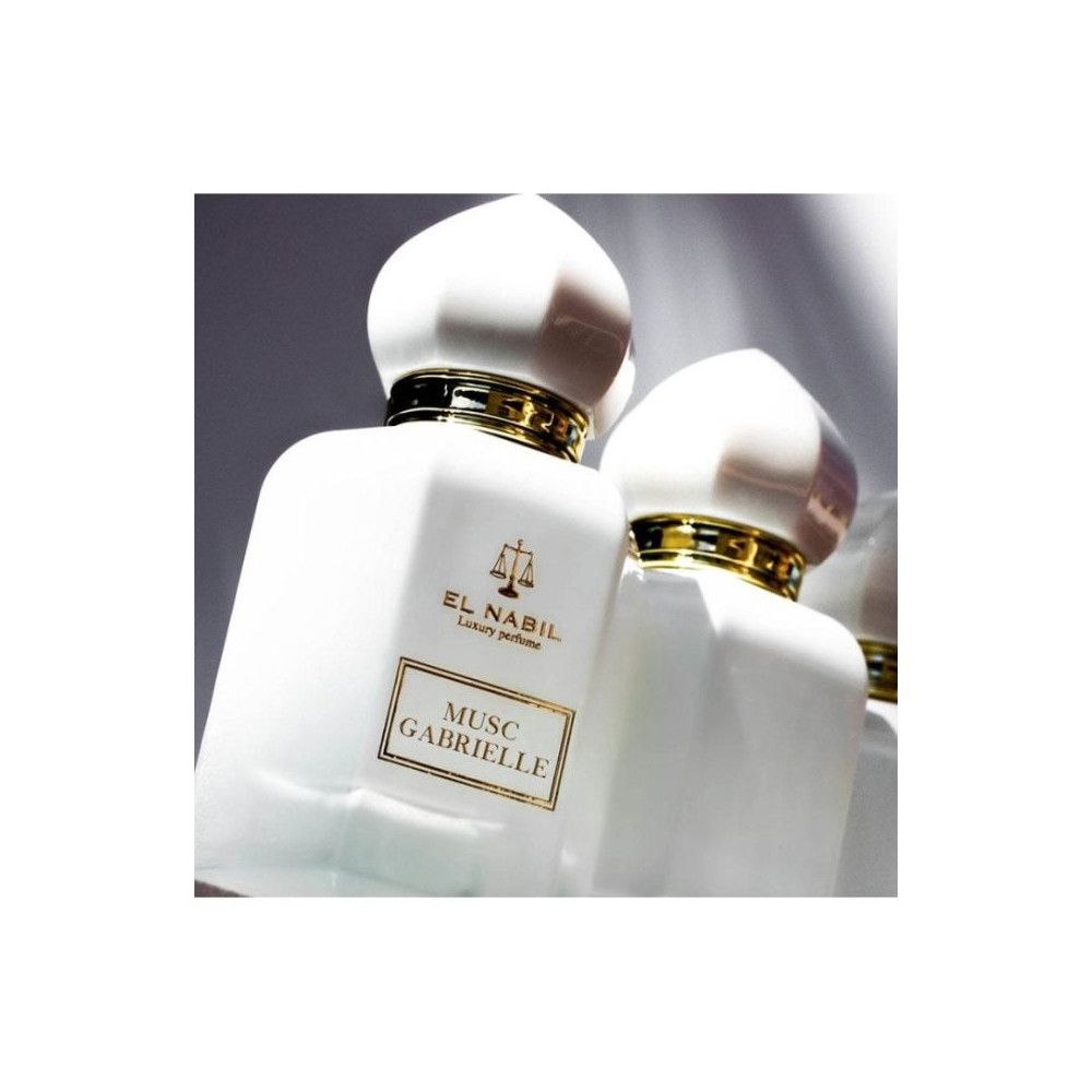 Zwei weiße Flakons mit goldenen Akzenten und Deckeln. Aufschrift: El Nabil, Musc Gabrielle.