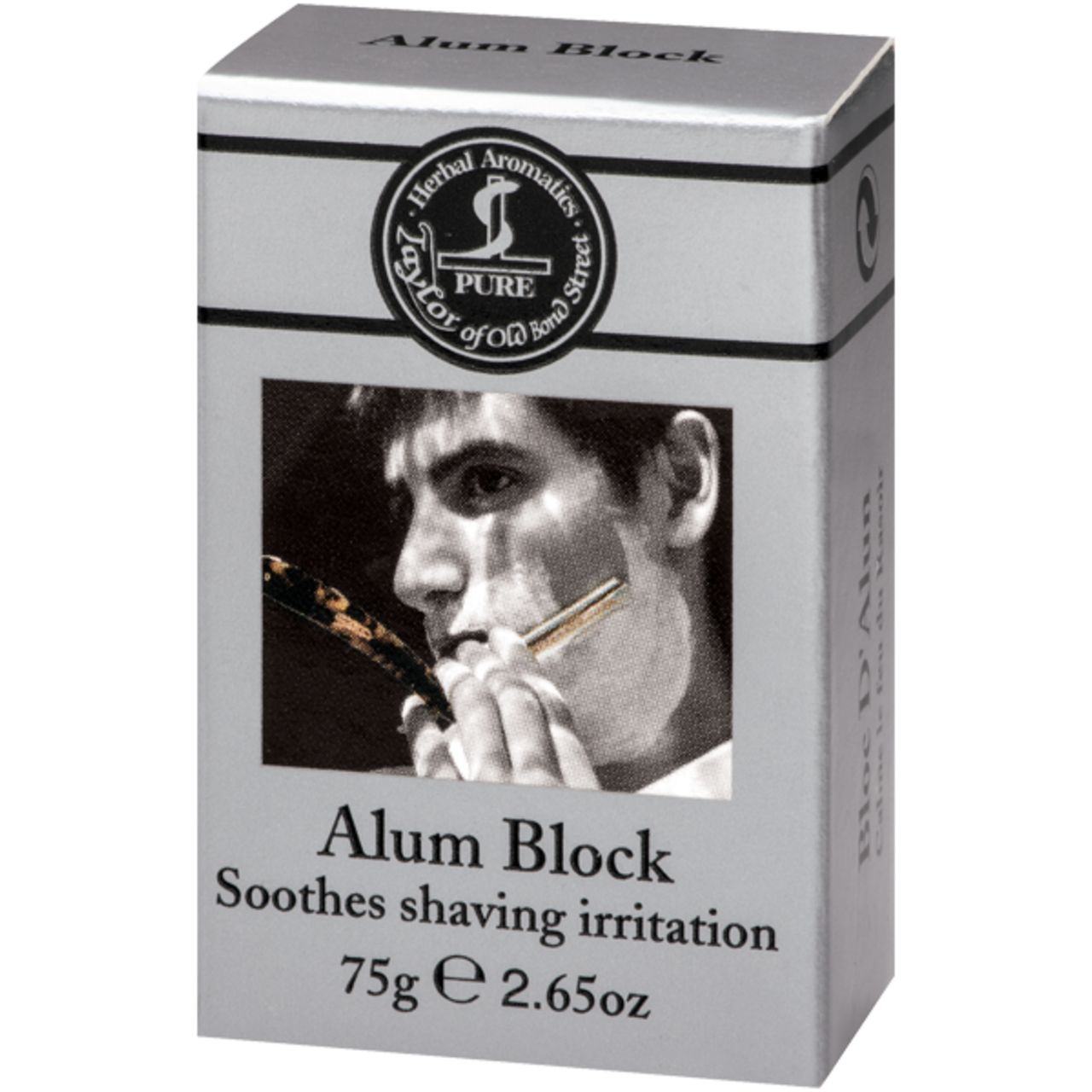 Aluminiumblock in silberner Verpackung. Aufdruck: Taylor of Old Bond Street, Alum Block, 75g. Abbildung eines Mannes beim Rasieren.