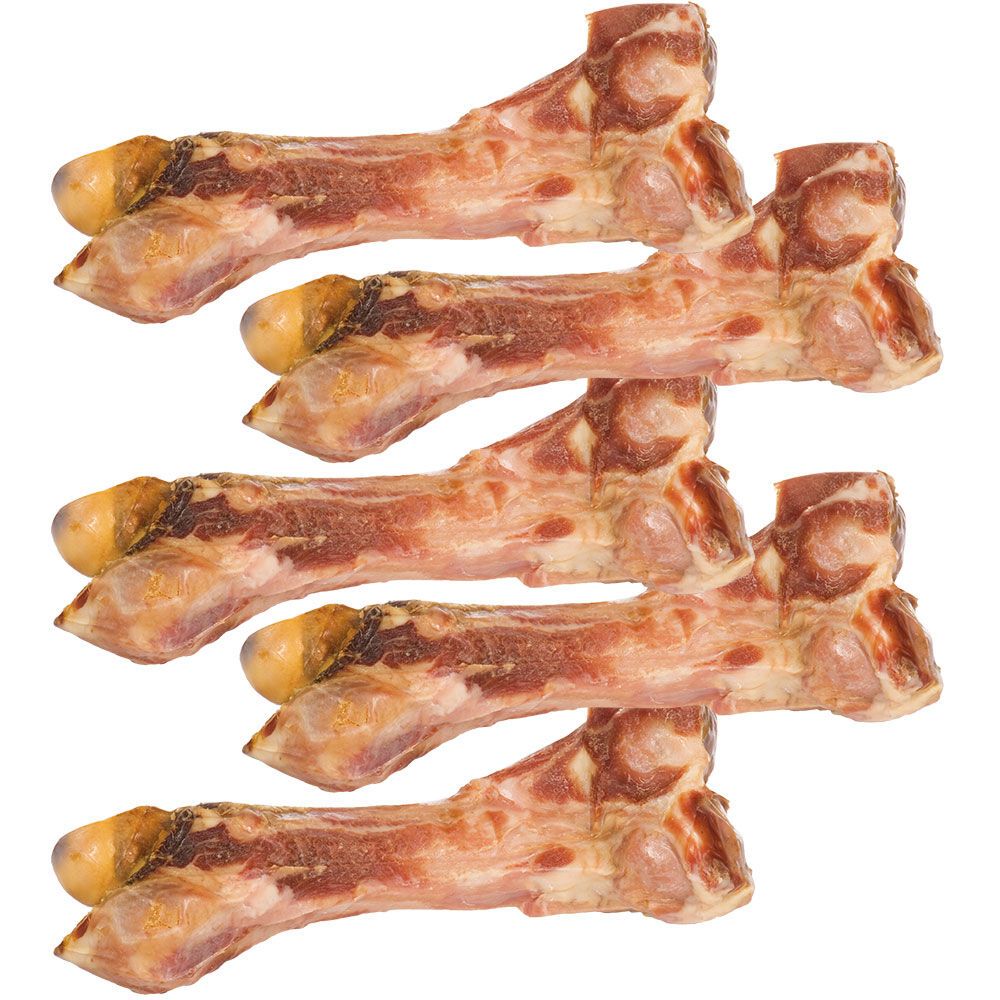 Mehrere Kauknochen, Ansicht von oben. Knochen mit Fleisch, gelben Enden. Auf weißem Hintergrund.