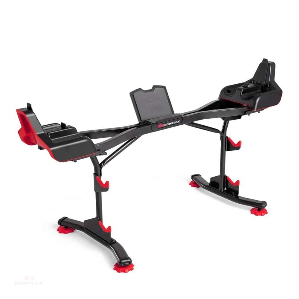 Schwarzer Langhantelständer mit roten Akzenten. Das Bowflex-Logo ist sichtbar. Der Ständer hat eine längliche Form mit mehreren Halterungen.