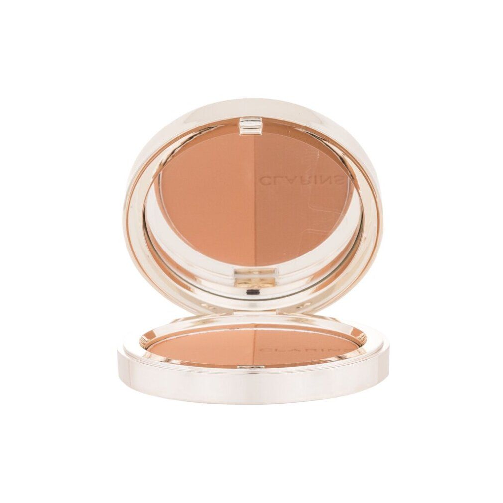 Bronzer-Kompaktpuder mit Spiegel. Runde Form, zwei Farbtöne. Marke Clarins. Silberfarbener Rahmen.