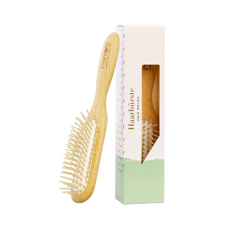 REMOs Haarbürste schmal mit Holzstiften in Verkaufsverpackung.