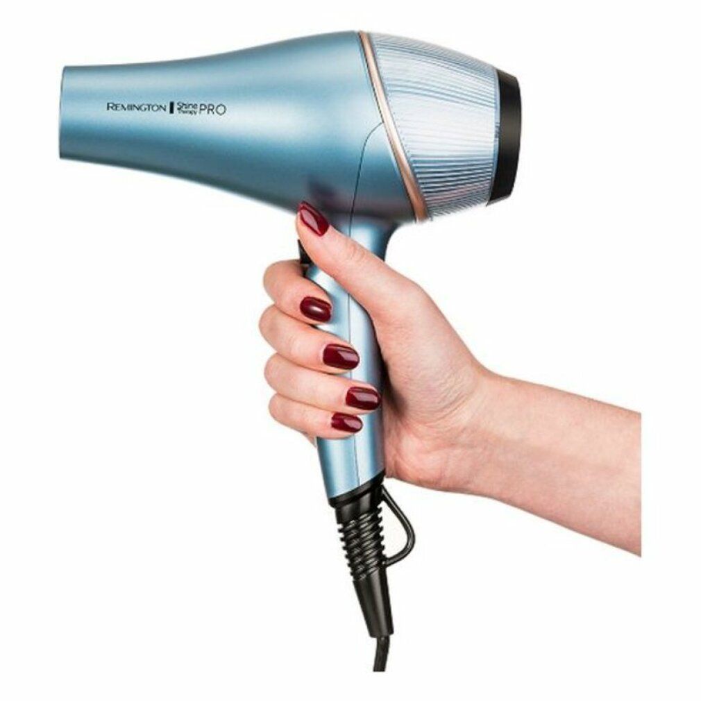Blau-metallischer Haartrockner in Hand. Marke Remington Shine Therapy PRO.