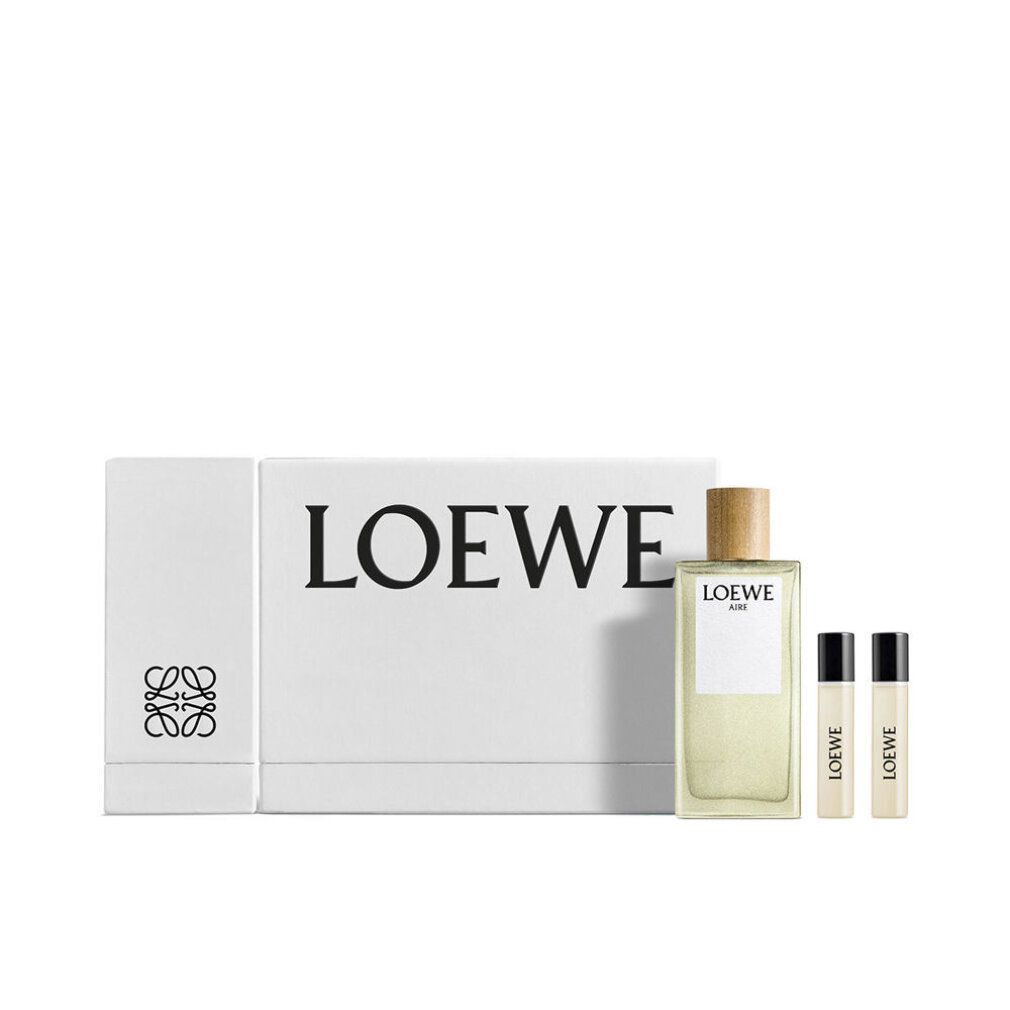 Weißer Karton mit LOEWE-Logo, Flakon und zwei Proben. Flakon mit Holzverschluss, helle Flüssigkeit. Proben mit schwarzem Deckel.