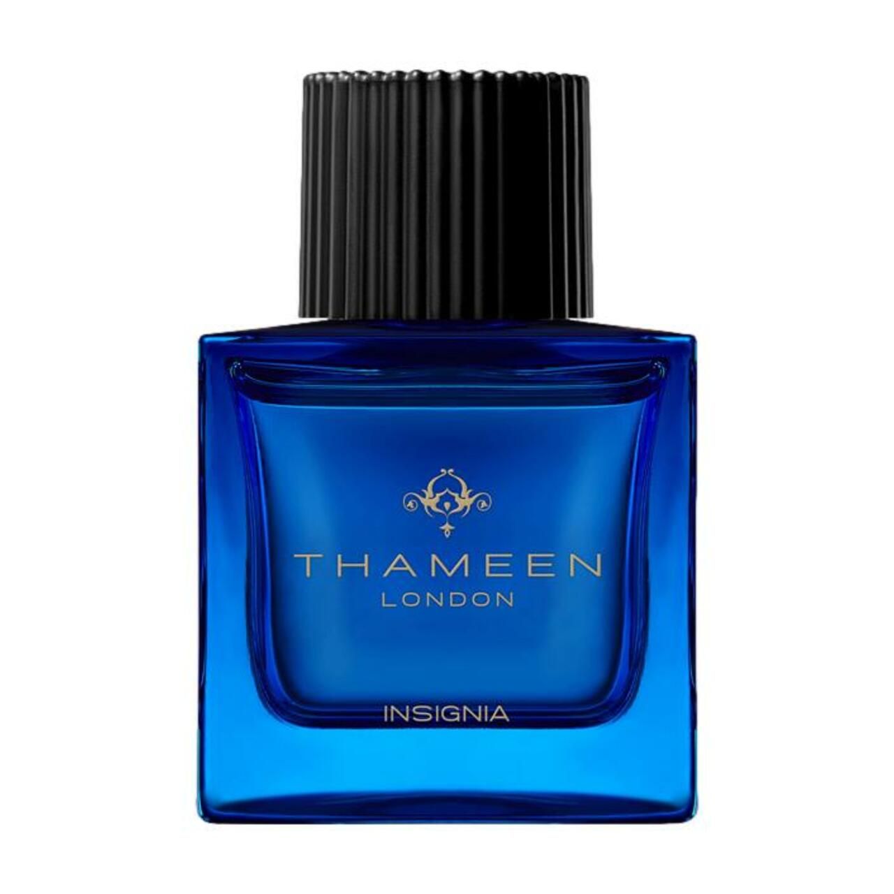 Blauer Flakon mit schwarzem Verschluss. Aufschrift: Thameen London, Insignia.