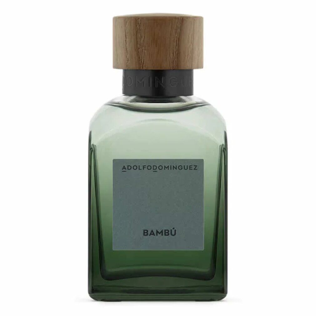 Grüne Glasflasche mit Holzdeckel. Auf dem Etikett steht "ADOLFO DOMINGUEZ BAMBÚ".