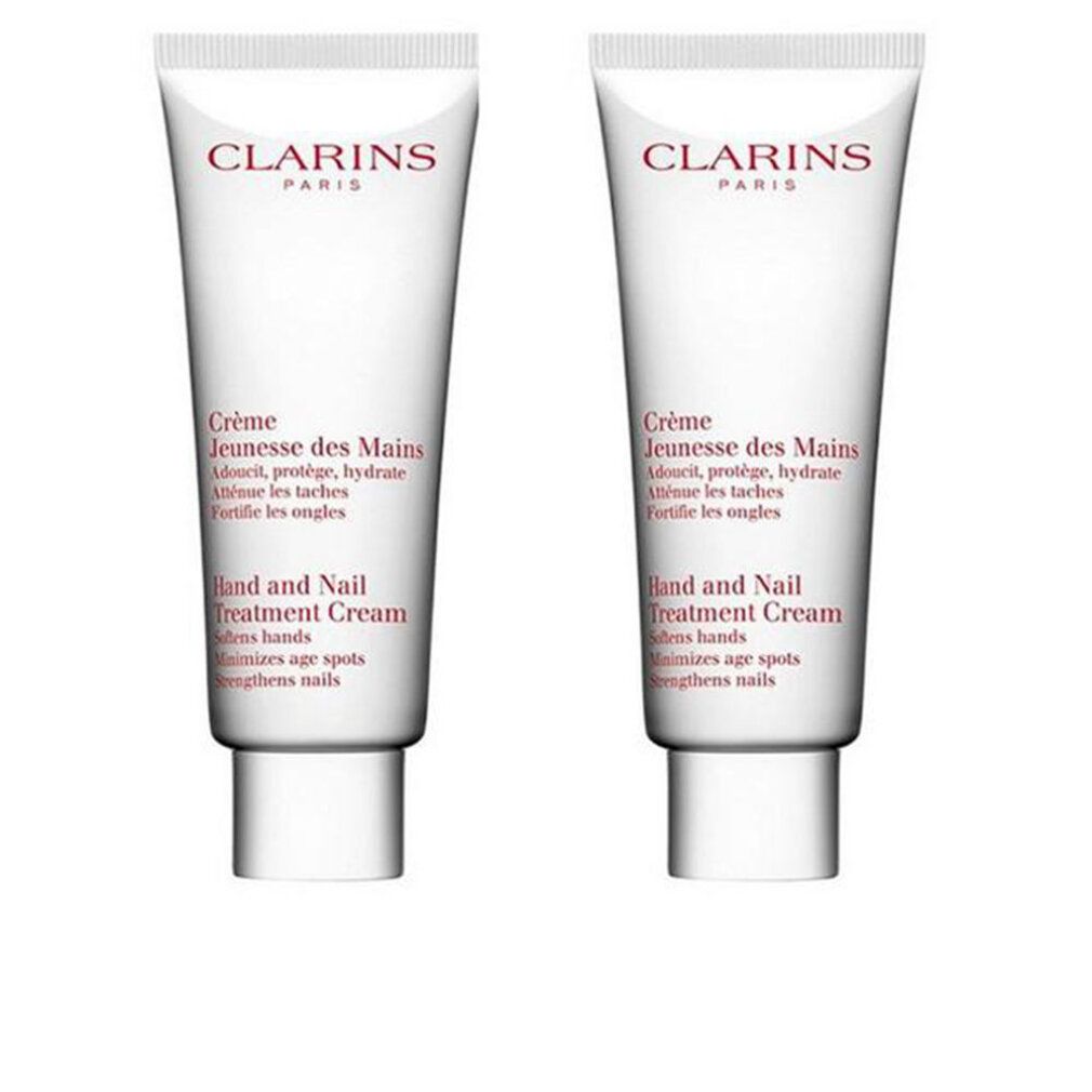 Zwei Tuben Clarins Crème Jeunesse des Mains. Weiß, mit roter Schrift. Text: Hand and Nail Treatment Cream.