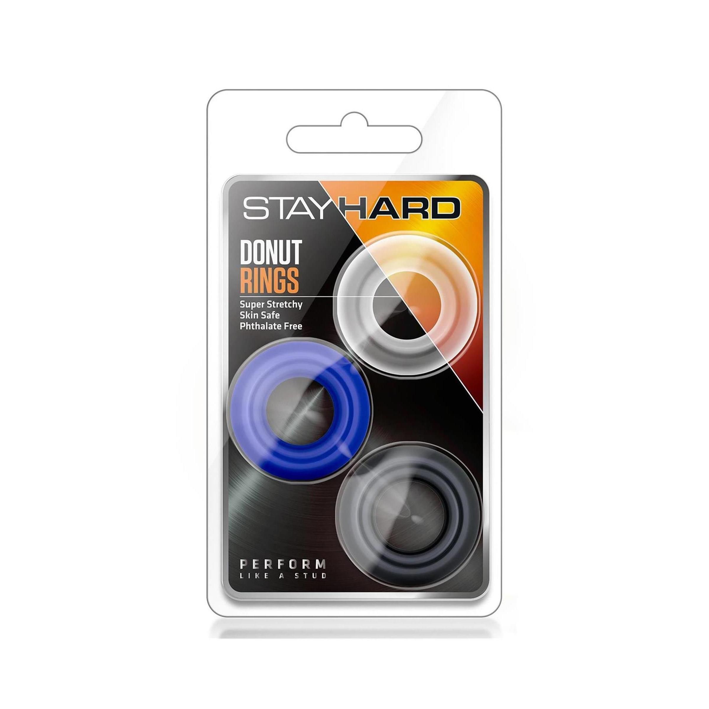 Verpackung mit drei Ringen in Schwarz, Blau und Transparent. Aufschrift: STAY HARD, DONUT RINGS, PERFORM.