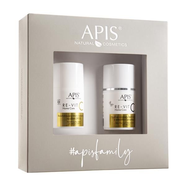 Geschenkset mit zwei Cremes. Weiße Flaschen mit goldfarbenen Etiketten in einer grauen Box. Aufschrift: APIS, RE-VIT C.
