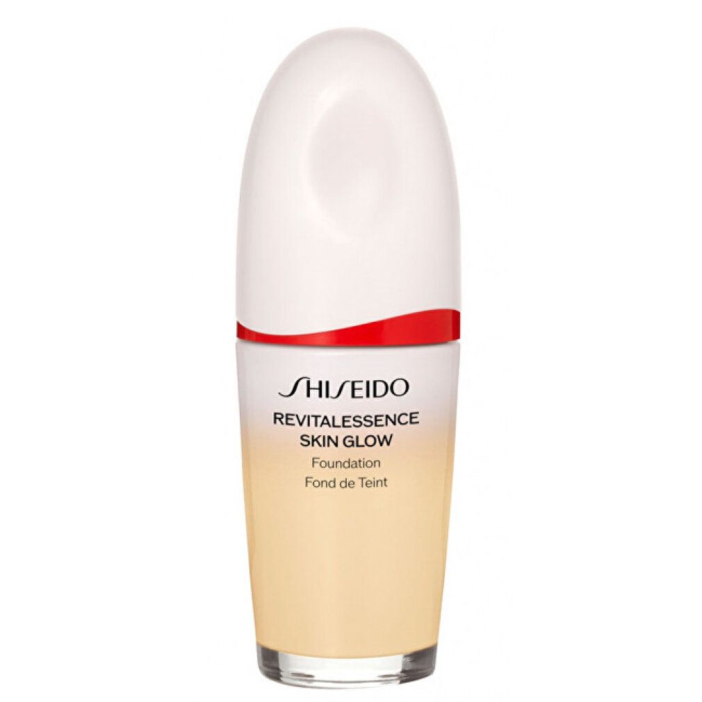 Shiseido Revitalessence Skin Glow Foundation. Flasche mit weißem Deckel, rotem Akzent und Farbverlauf. Produktname auf der Flasche.