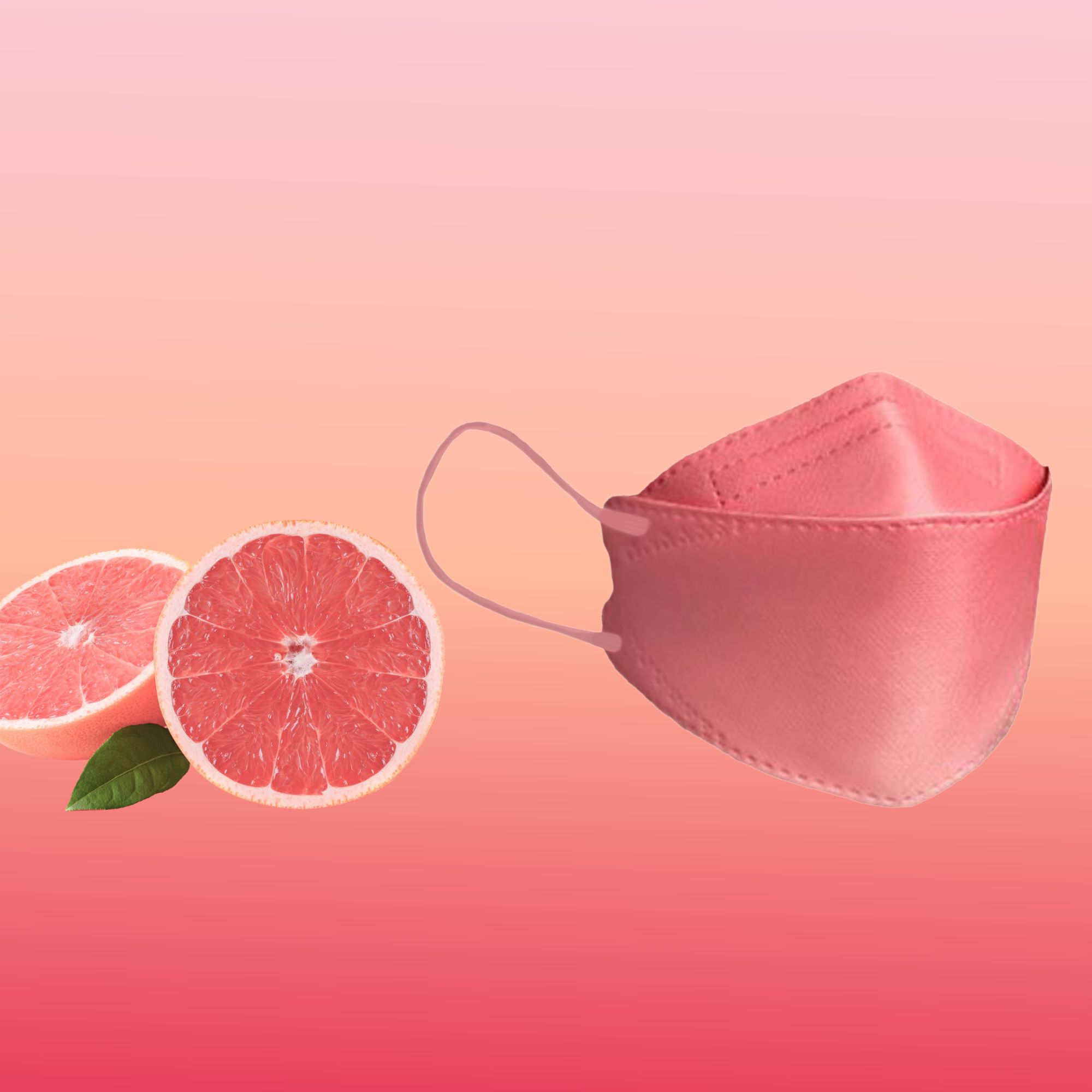 Eine korallfarbene FFP2-Maske liegt neben zwei Hälften einer Grapefruit auf einem rosafarbenen Hintergrund.